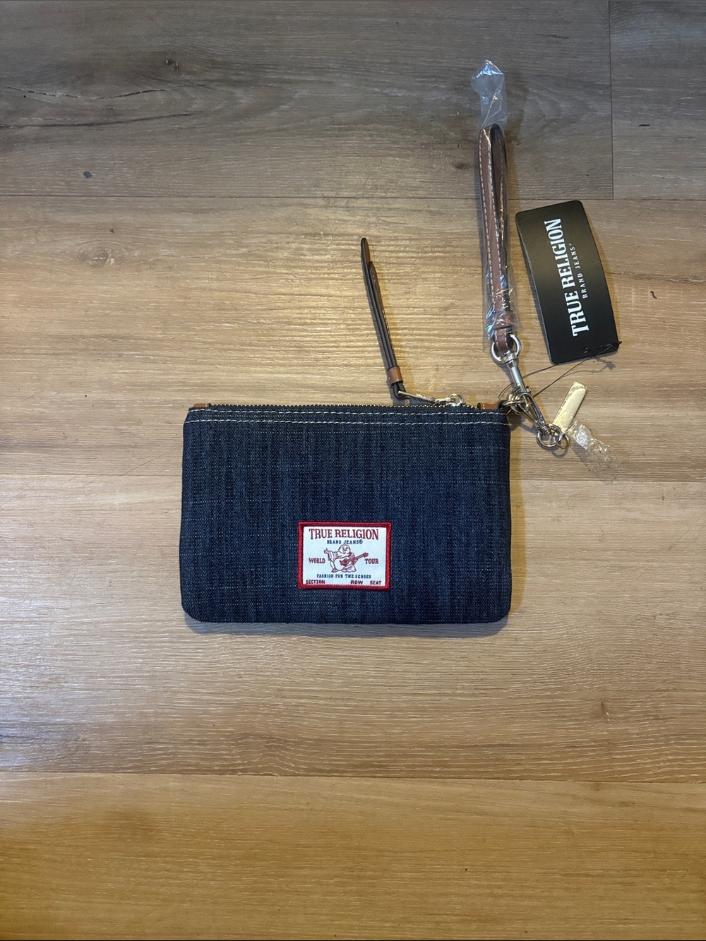 True Religion Dark Denim Wristlet with Brown Leather Strap